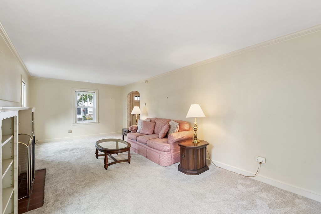 41 Sevinor Road Marblehead, MA 01945 - Photo 6 of 30 a living room with furniture a lamp and a window