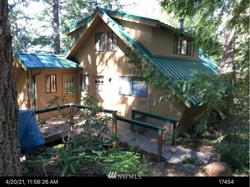 2300 East Quilcene Road Quilcene, WA 98376 - Photo 1 of 9 a view of house with a yard