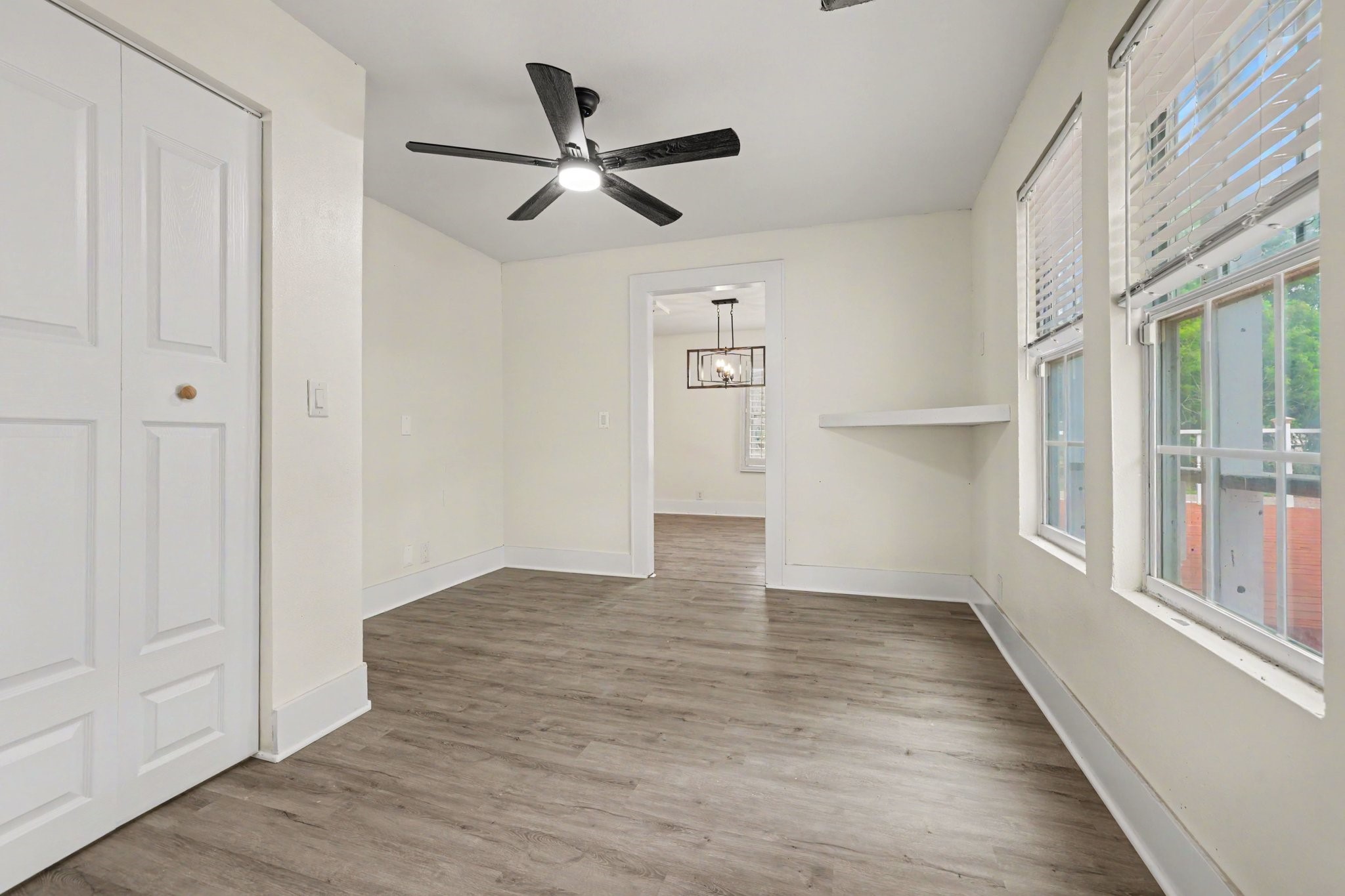 31730 Waller Tomball Road Waller, TX 77484 - Photo 22 of 50 Bright study room with large windows and a small built-in shelf.