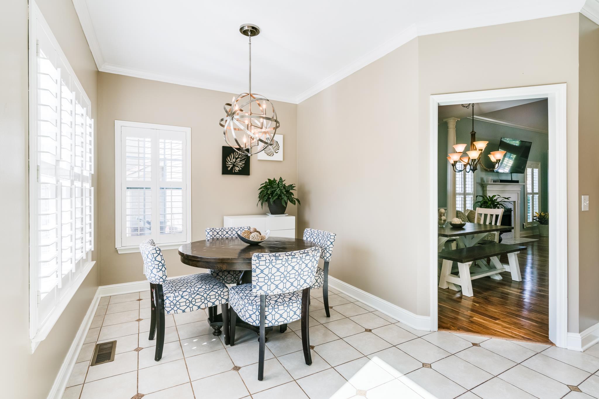 3126 Vera Valley Road Franklin, TN 37064 - Photo 14 of 30 a dining room with furniture a chandelier and kitchen view