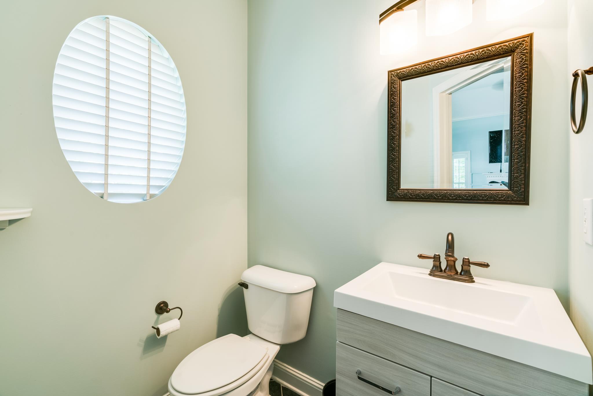 3126 Vera Valley Road Franklin, TN 37064 - Photo 15 of 30 a bathroom with a sink a mirror and a toilet