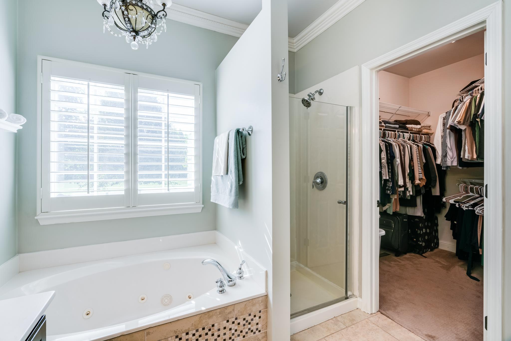 3126 Vera Valley Road Franklin, TN 37064 - Photo 20 of 30 a bathroom with a bathtub and a shower