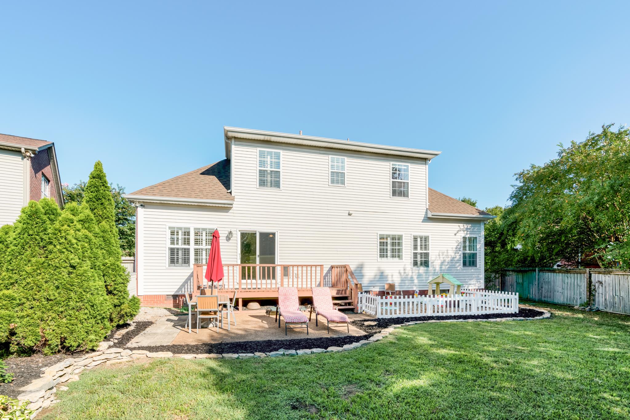 3126 Vera Valley Road Franklin, TN 37064 - Photo 27 of 30 a view of a house with backyard sitting area and garden
