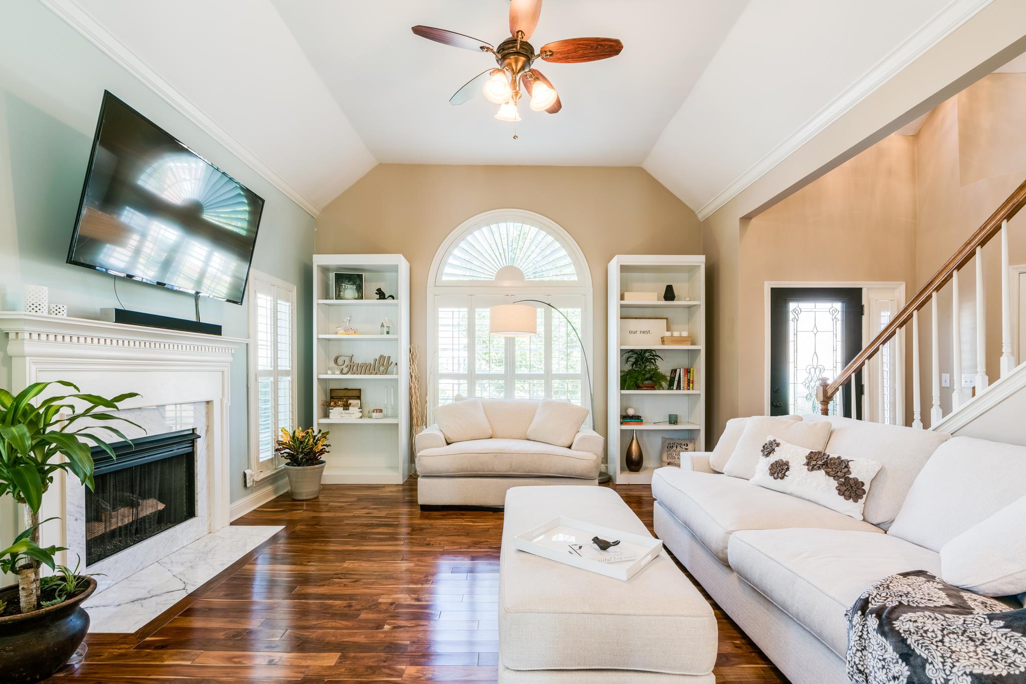 3126 Vera Valley Road Franklin, TN 37064 - Photo 5 of 30 a living room with furniture a fireplace and a flat screen tv