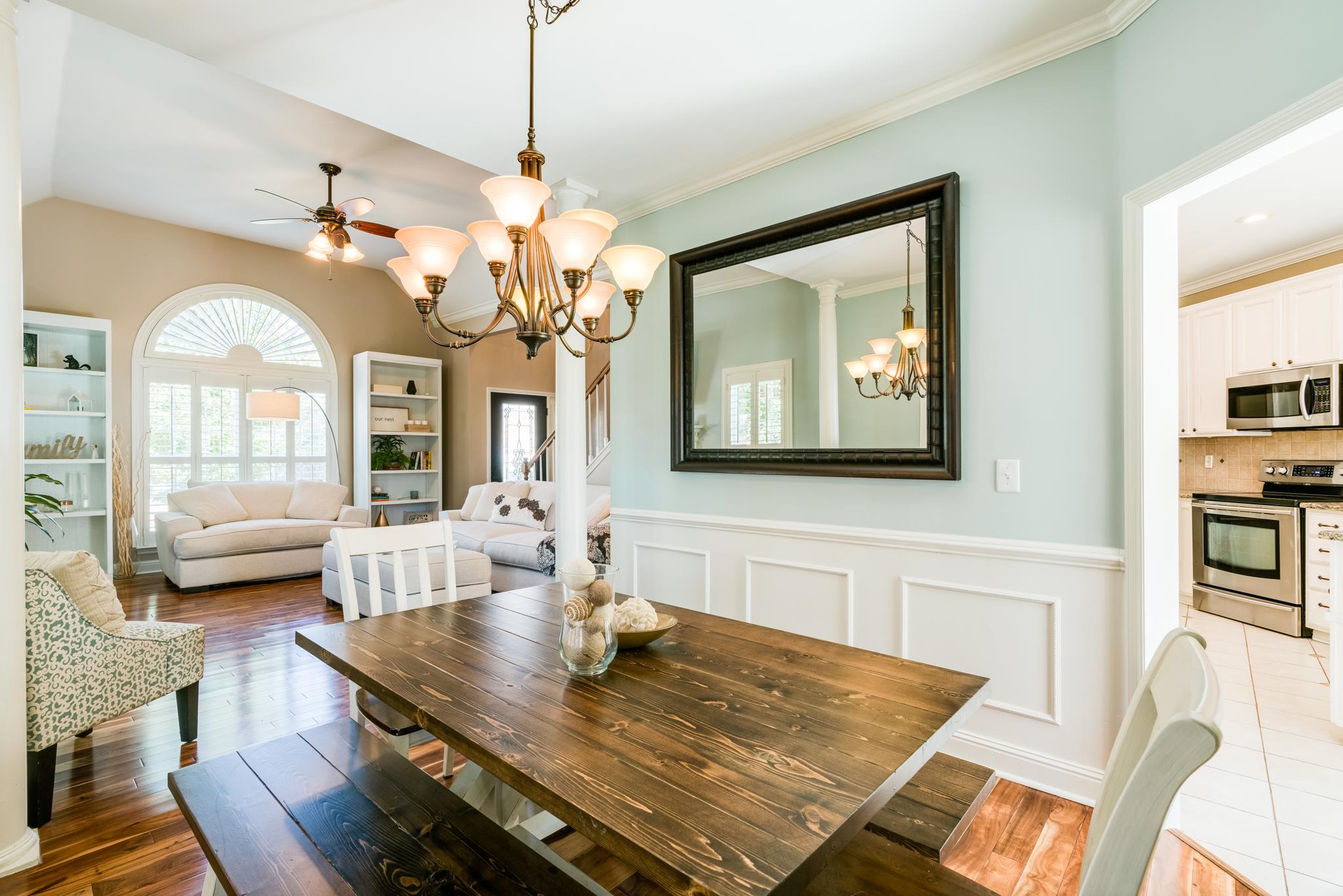 3126 Vera Valley Road Franklin, TN 37064 - Photo 10 of 30 a view of a dining room with furniture a chandelier and wooden floor