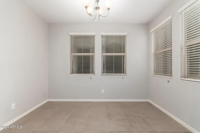 a view of empty room with windows