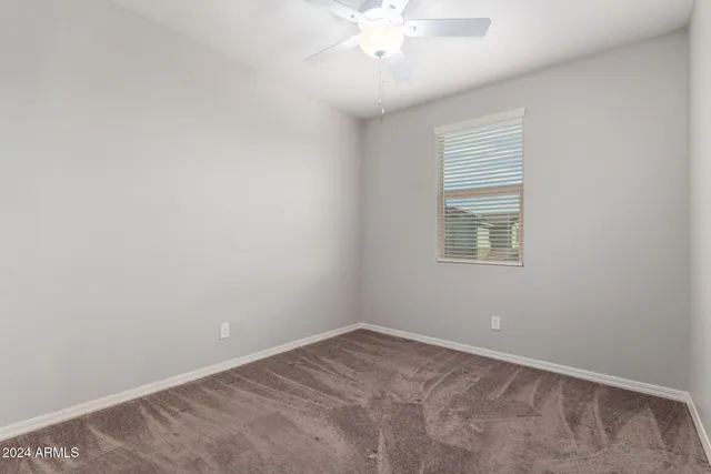 an empty room with closet area