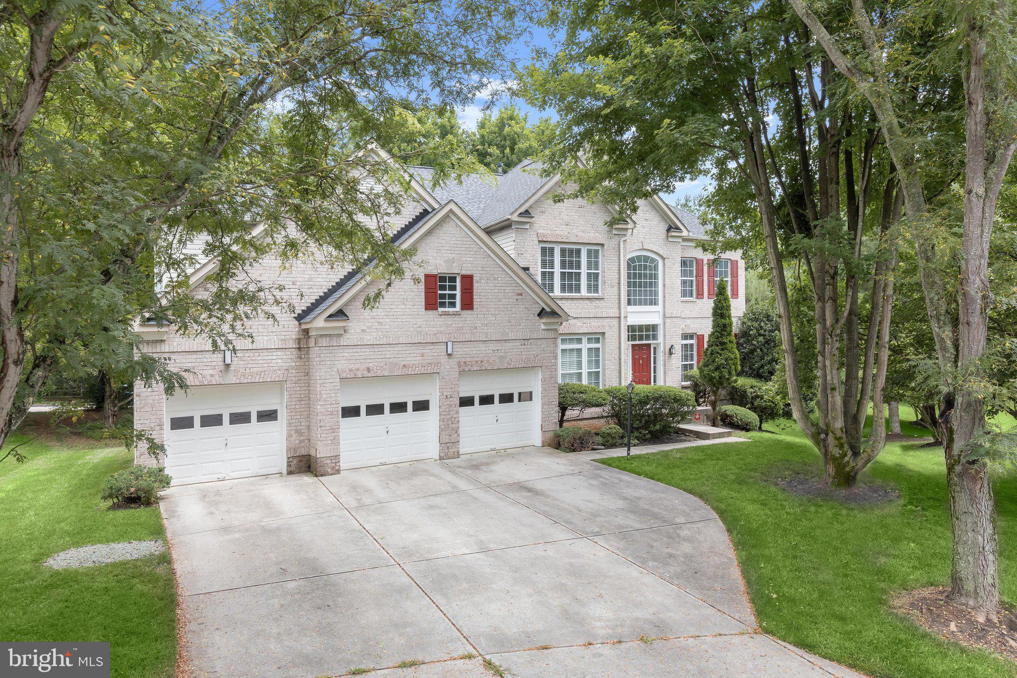 6111 Rippling Tides Terrace Clarksville, MD 21029 - Photo 80 of 84 a view of white house with a yard and large trees