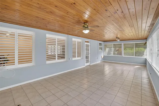 a view of a hallway with closet and bathroom