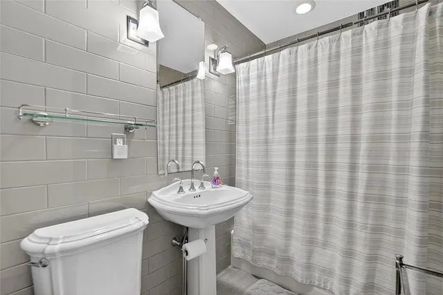 a bathroom with a bathtub and shower