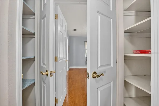 a view of an empty room with windows