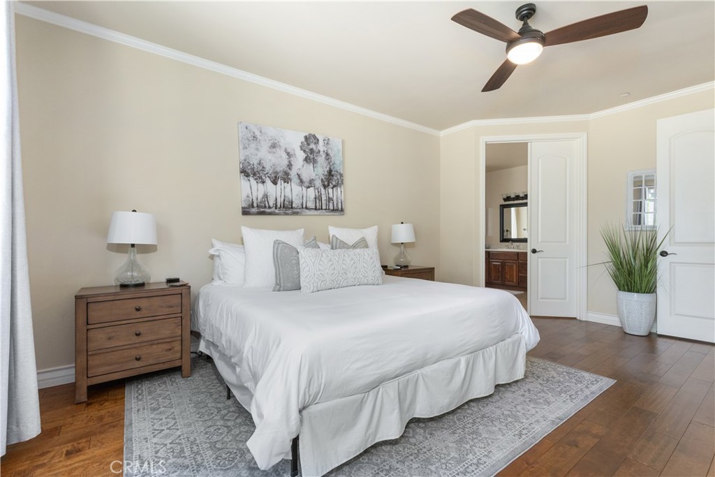 669 Red Cloud Road Paso Robles, CA 93446 - Photo 21 of 61 a bedroom with a bed and wooden floor