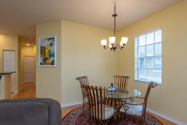 a view of a dining room with furniture window and outside view