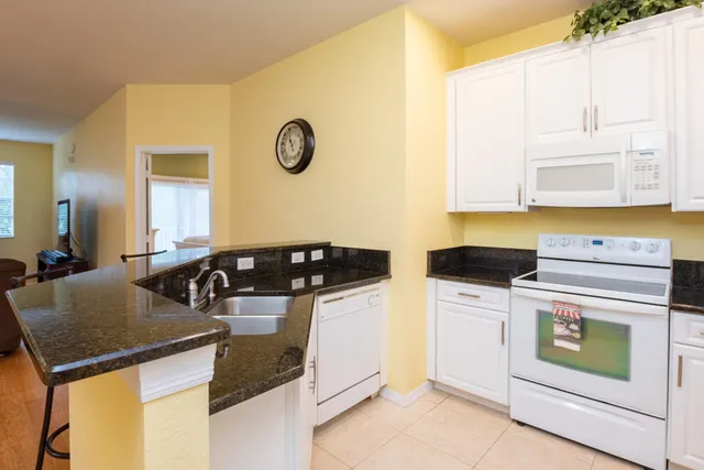 a kitchen with a stove and a refrigerator
