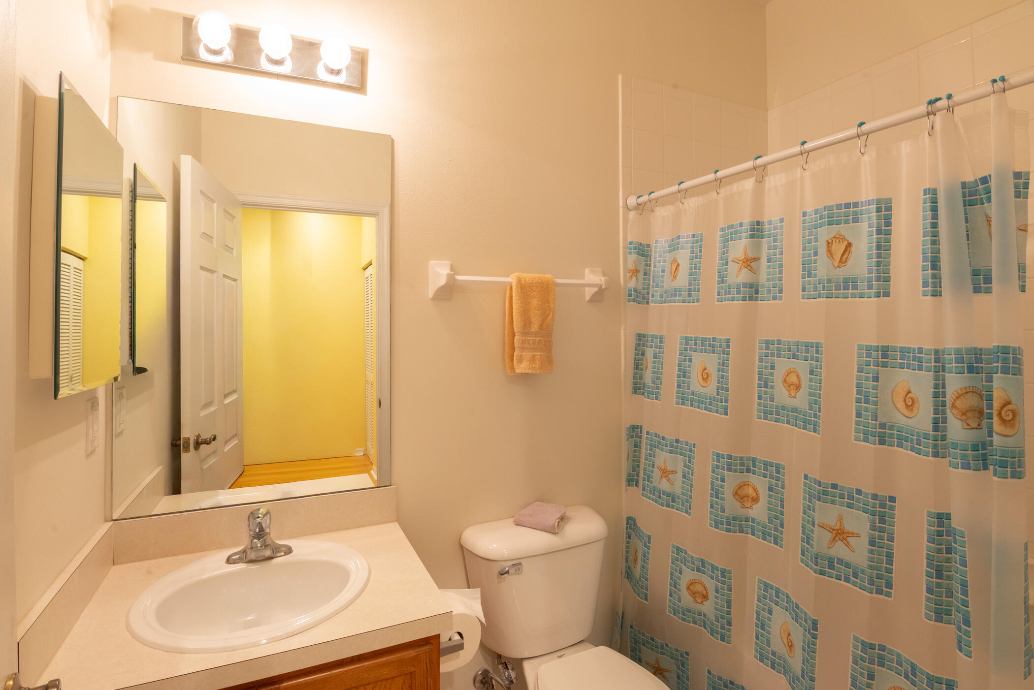 1600 Southeast Sheffield Terrace, Unit 201 Stuart, FL 34994 - Photo 22 of 28 a bathroom with a sink a toilet and shower