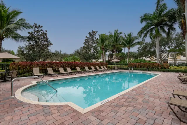a view of a swimming pool with a lounge chairs
