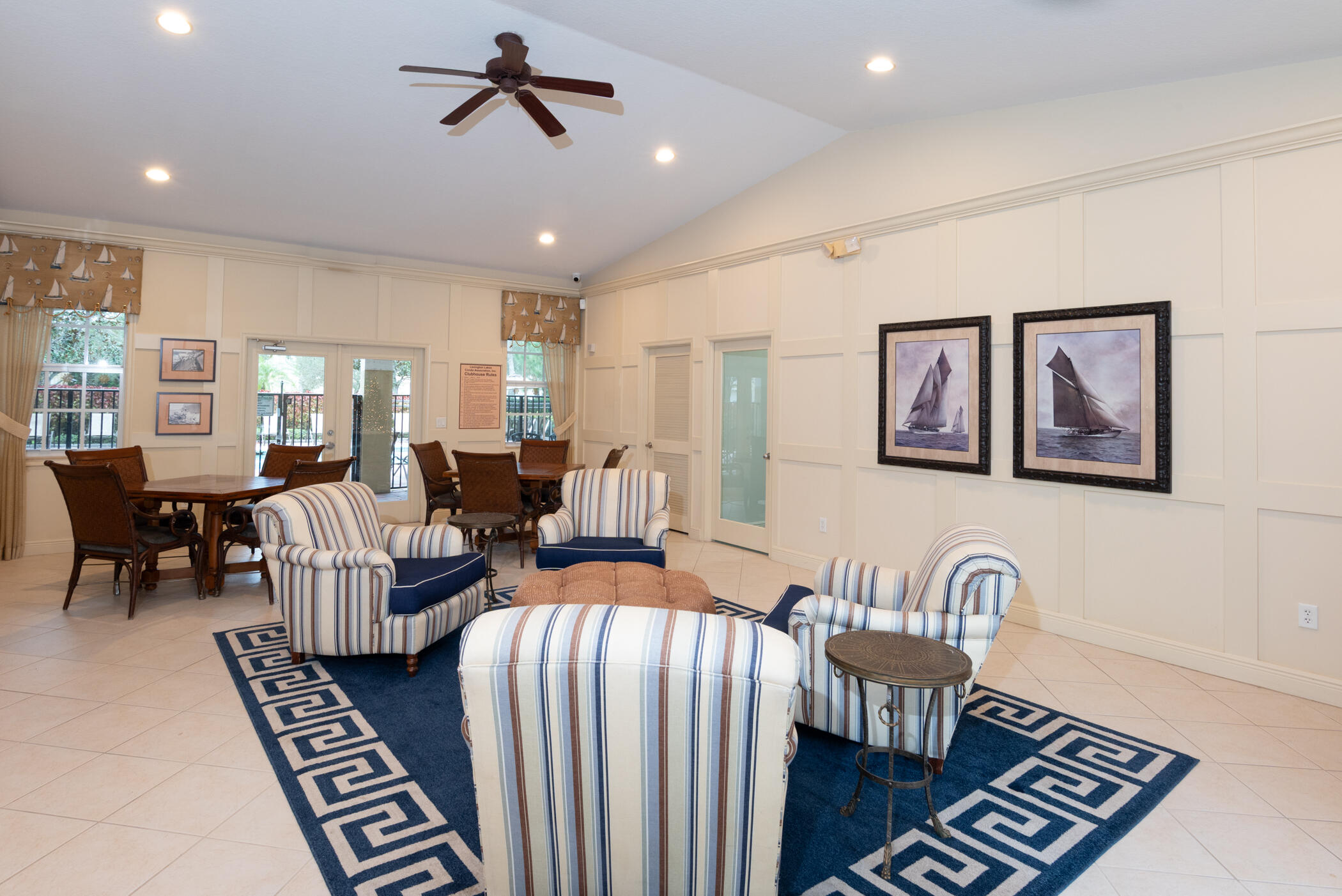 1600 Southeast Sheffield Terrace, Unit 201 Stuart, FL 34994 - Photo 26 of 28 a living room with furniture and a dining table