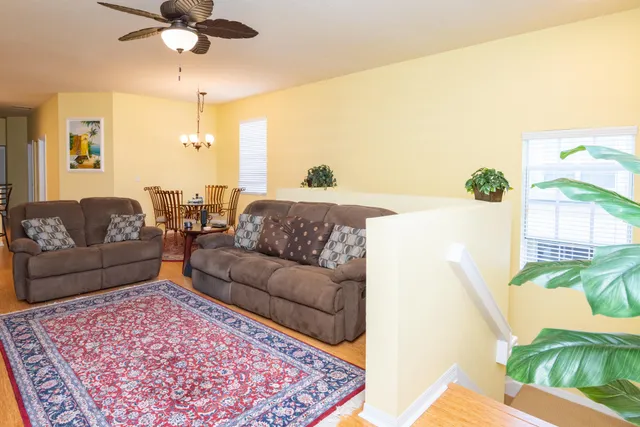 a living room with furniture and a rug