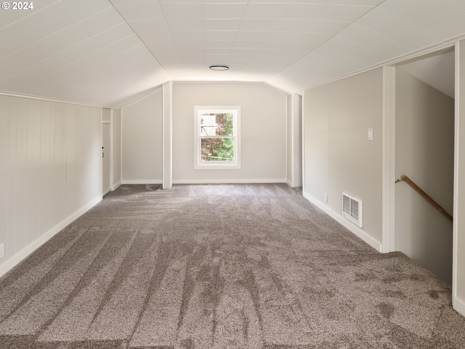 10342 Southeast Ramona Street Portland, OR 97266 - Photo 15 of 17 a view of an empty room with a window