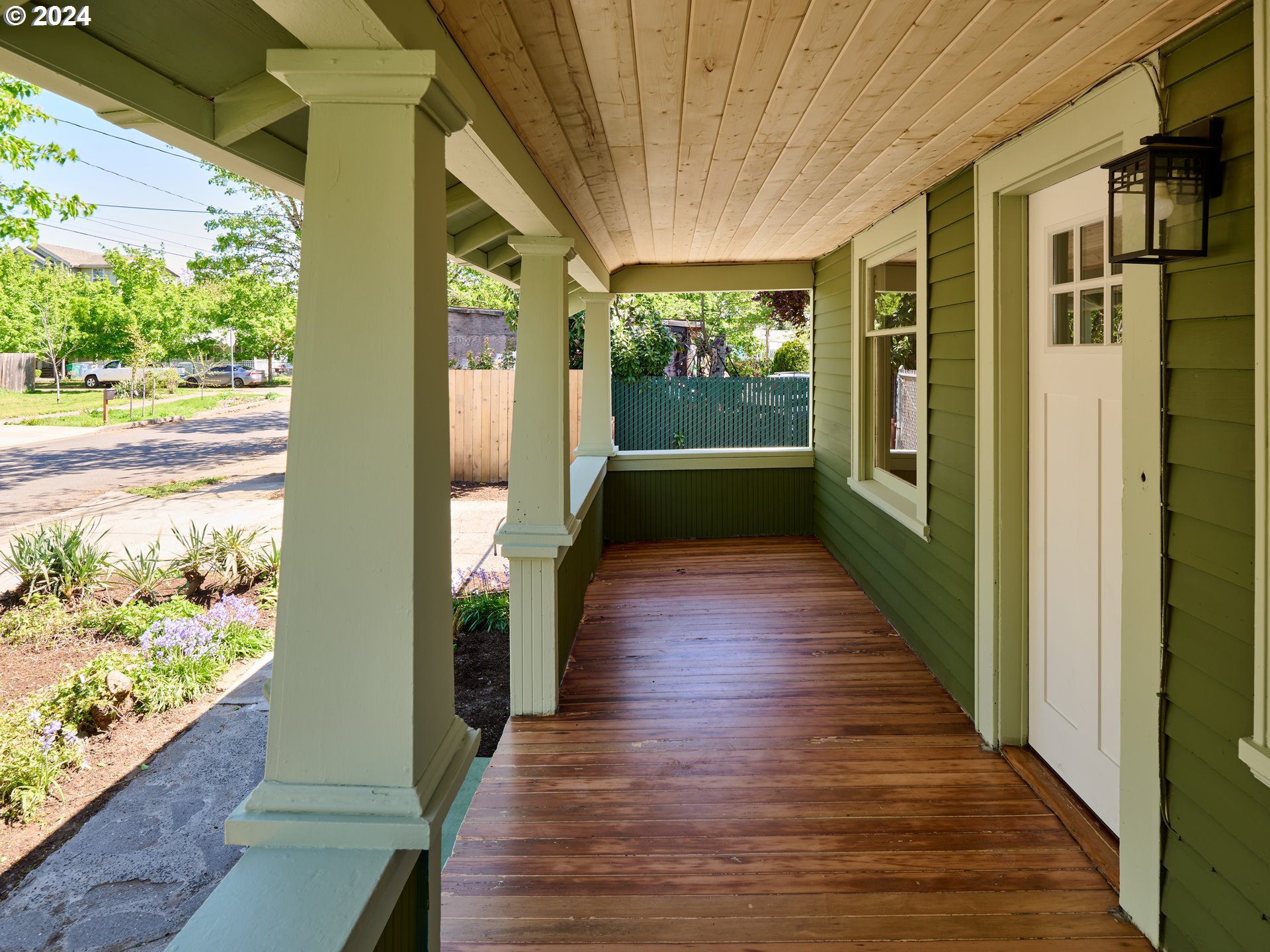 10342 Southeast Ramona Street Portland, OR 97266 - Photo 2 of 17 a porch with wooden floor