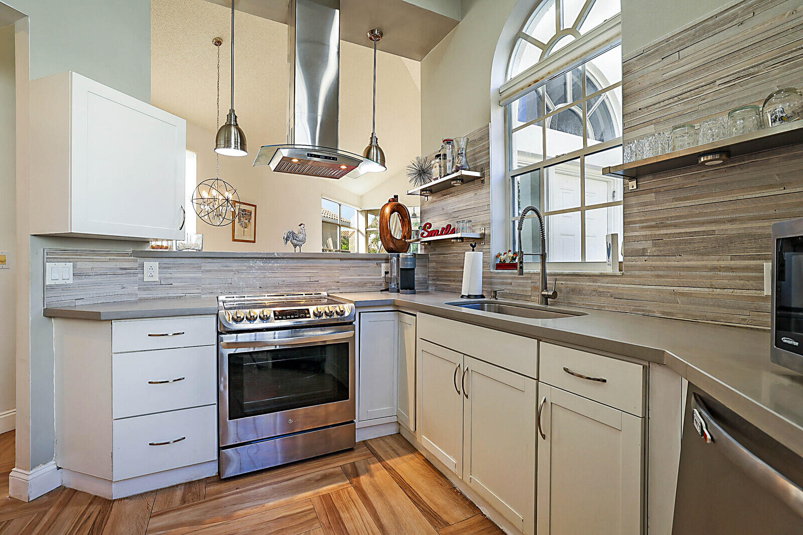 6655 Northwest 25th Avenue Boca Raton, FL 33496 - Photo 13 of 33 a kitchen with stainless steel appliances granite countertop a sink and cabinets