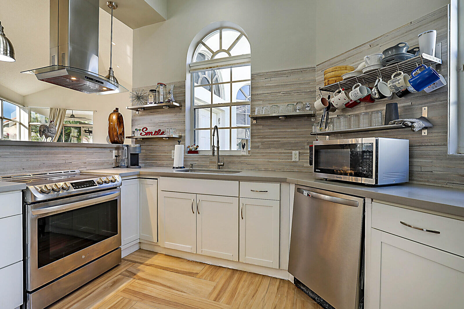 6655 Northwest 25th Avenue Boca Raton, FL 33496 - Photo 14 of 33 a kitchen with stainless steel appliances granite countertop a stove and a sink