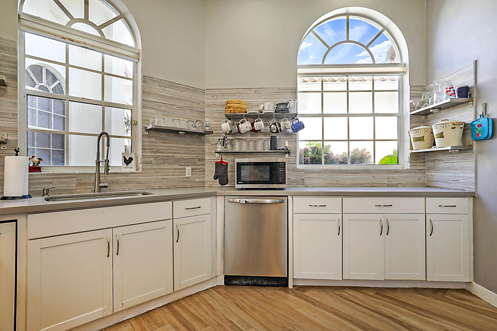 6655 Northwest 25th Avenue Boca Raton, FL 33496 - Photo 15 of 33 a kitchen with appliances cabinets and a large window