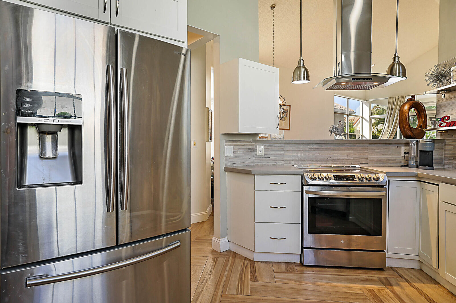 6655 Northwest 25th Avenue Boca Raton, FL 33496 - Photo 17 of 33 a kitchen with stainless steel appliances granite countertop a refrigerator and a stove