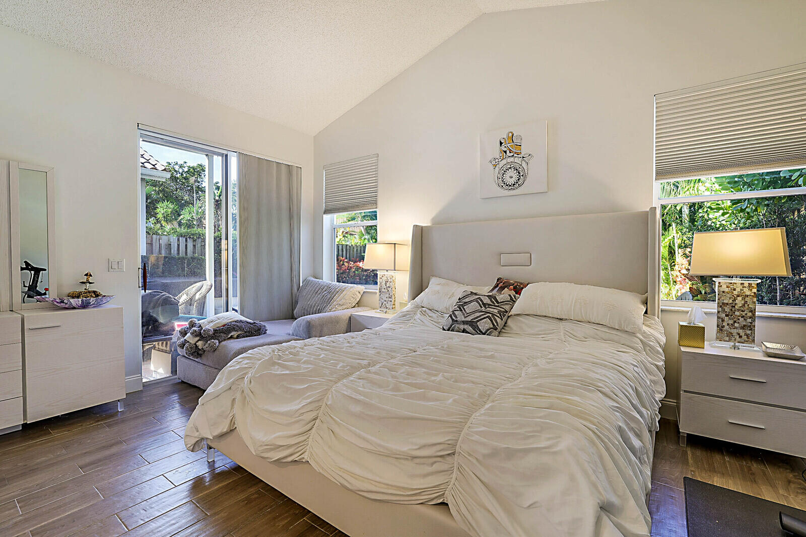 6655 Northwest 25th Avenue Boca Raton, FL 33496 - Photo 18 of 33 a bedroom with a bed and wooden floor
