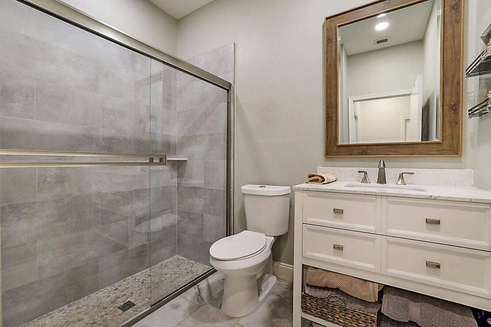 6655 Northwest 25th Avenue Boca Raton, FL 33496 - Photo 23 of 33 a bathroom with a sink a toilet and a mirror