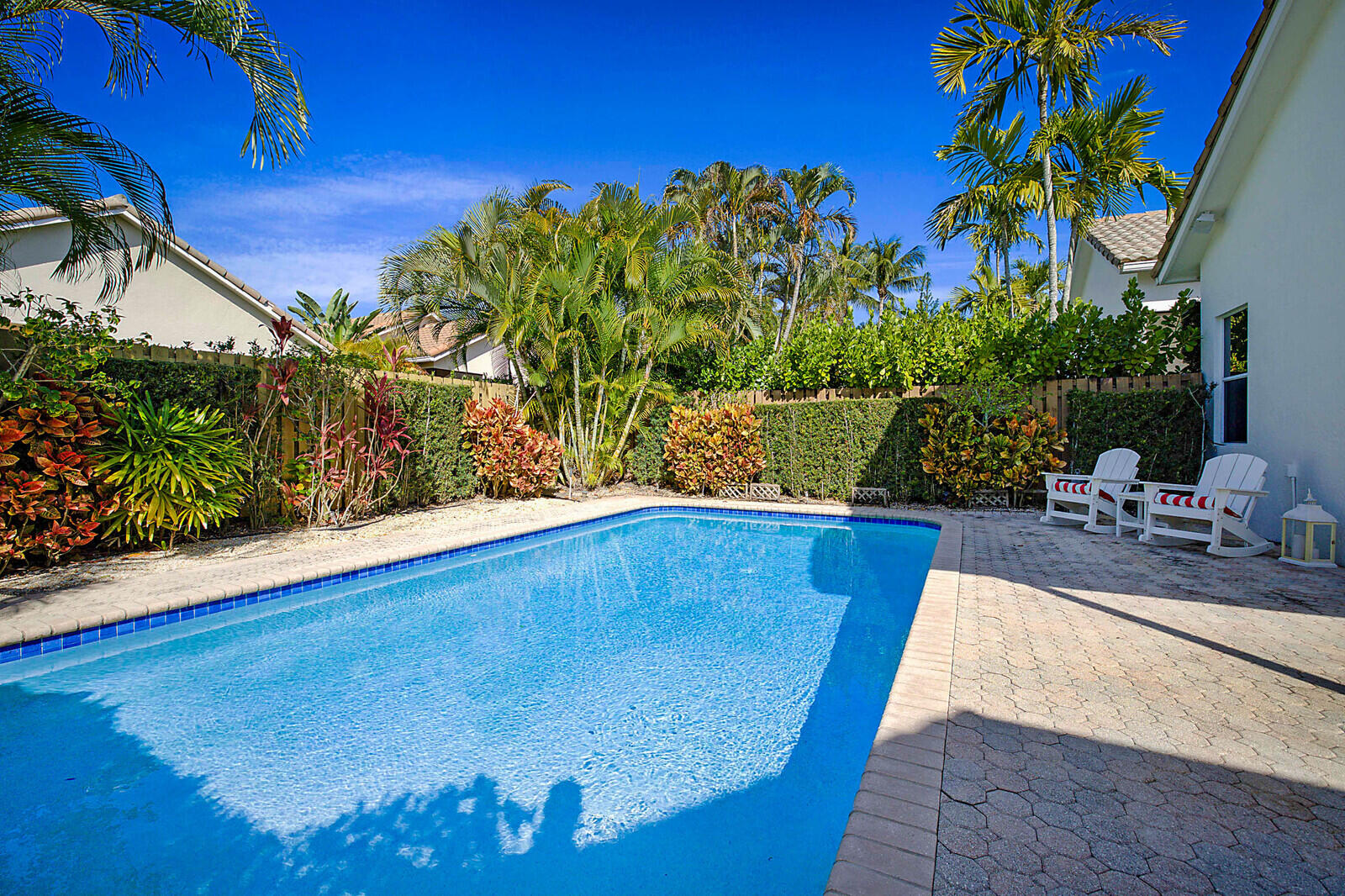 6655 Northwest 25th Avenue Boca Raton, FL 33496 - Photo 30 of 33 a view of a swimming pool with an outdoor seating