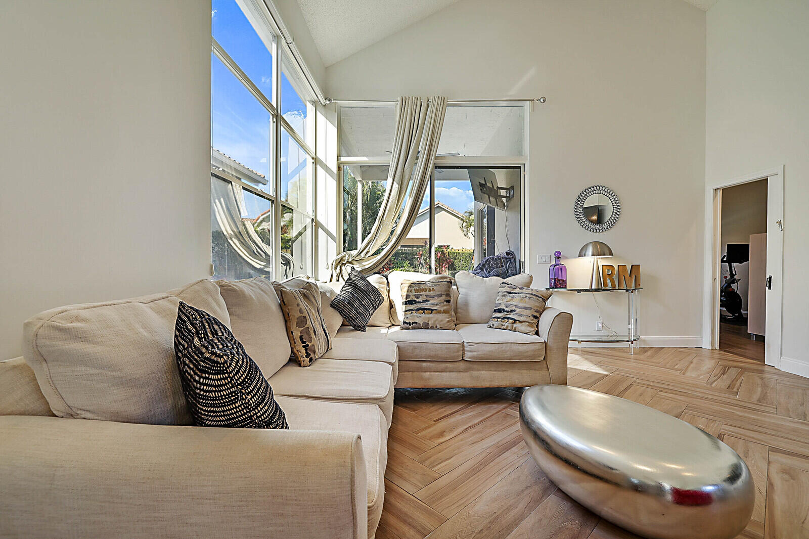 6655 Northwest 25th Avenue Boca Raton, FL 33496 - Photo 5 of 33 a living room with couches a fireplace and a dining table with wooden floor