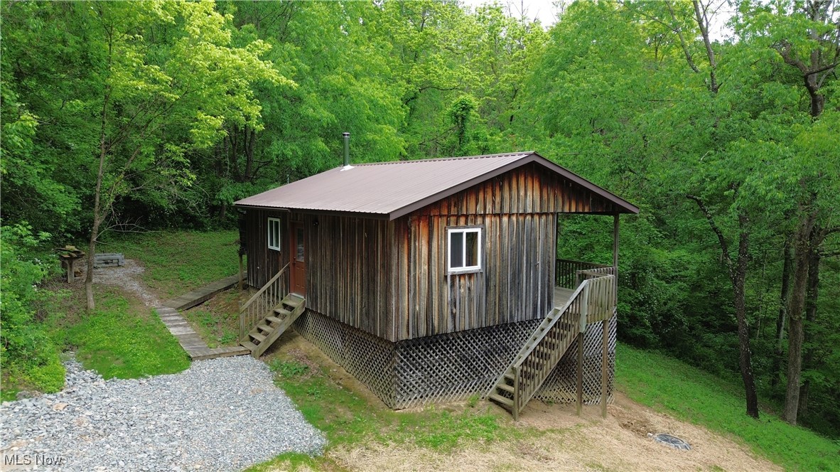 34215 Mt Hope Ridge Road Graysville, OH 45734 - Photo 1 of 50 View of outdoor structure featuring a view of trees