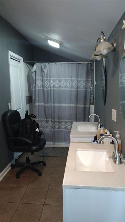 136 Hill Street Commerce, GA 30529 - Photo 21 of 27 a bathroom with a sink and a mirror