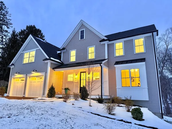 a front view of a house with a swimming pool