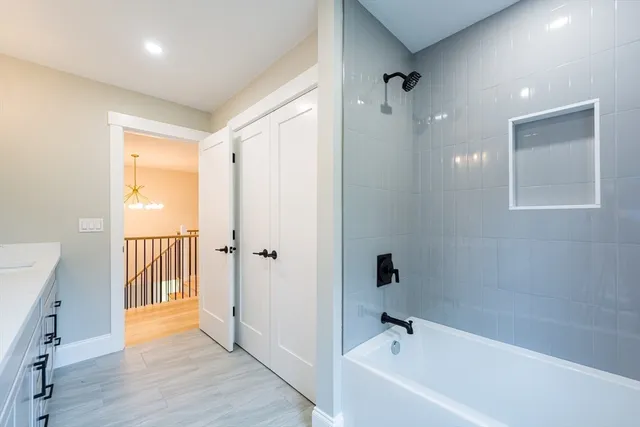 a bathroom with a bathtub and a shower