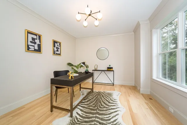 a living room with a table and a window