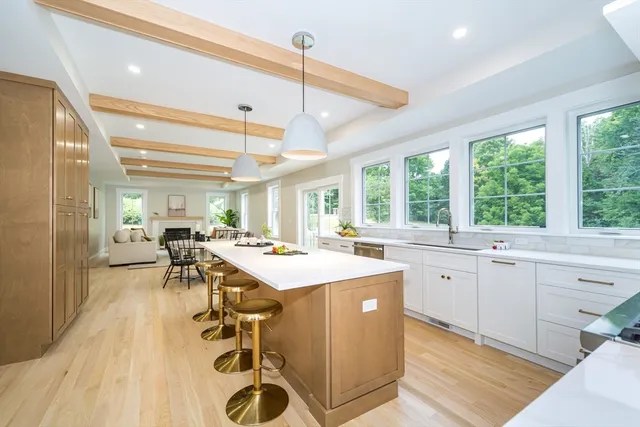 a kitchen with a sink a counter top space and appliances