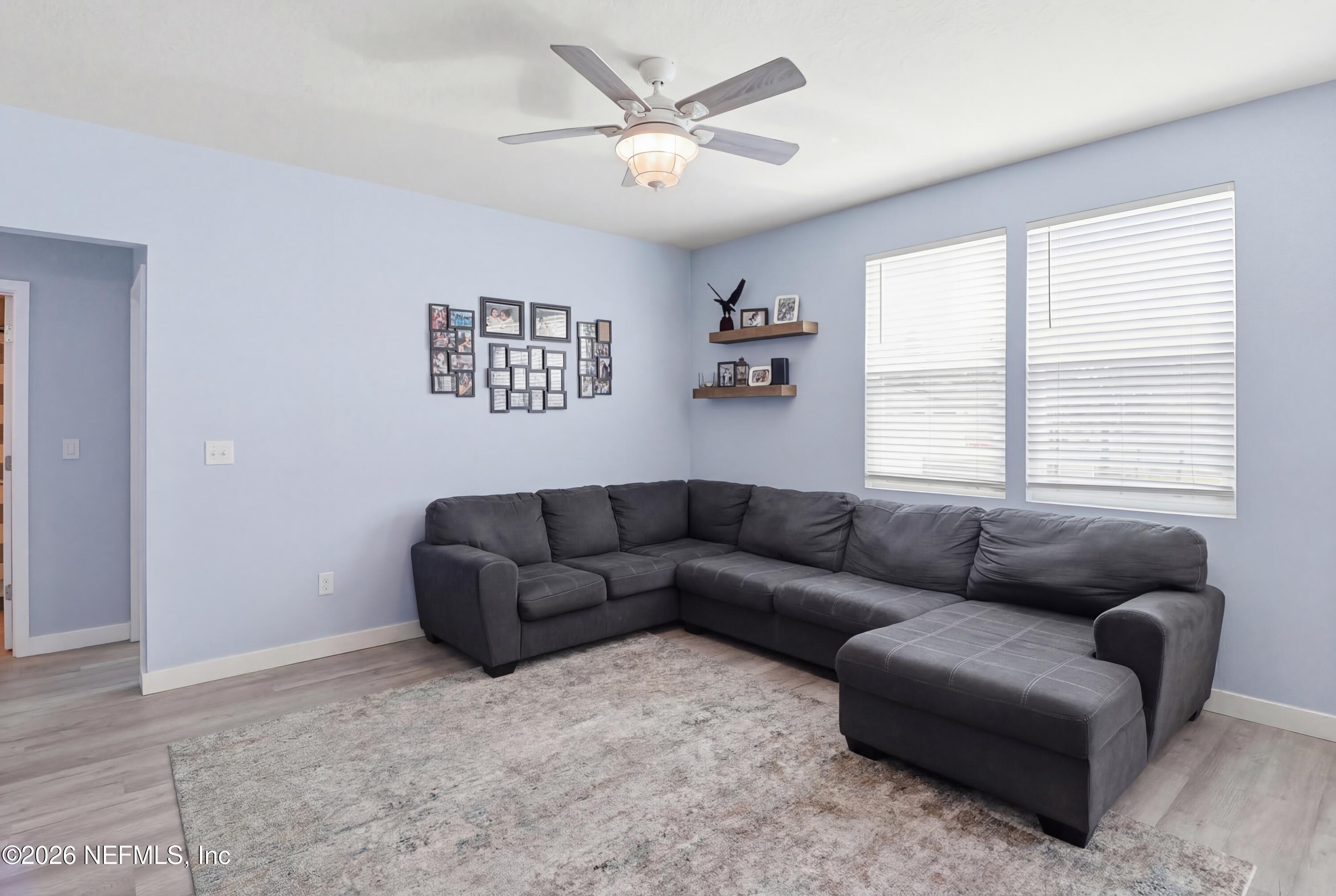 3825 Bronco Road Middleburg, FL 32068 - Photo 4 of 18 a living room with furniture and a window