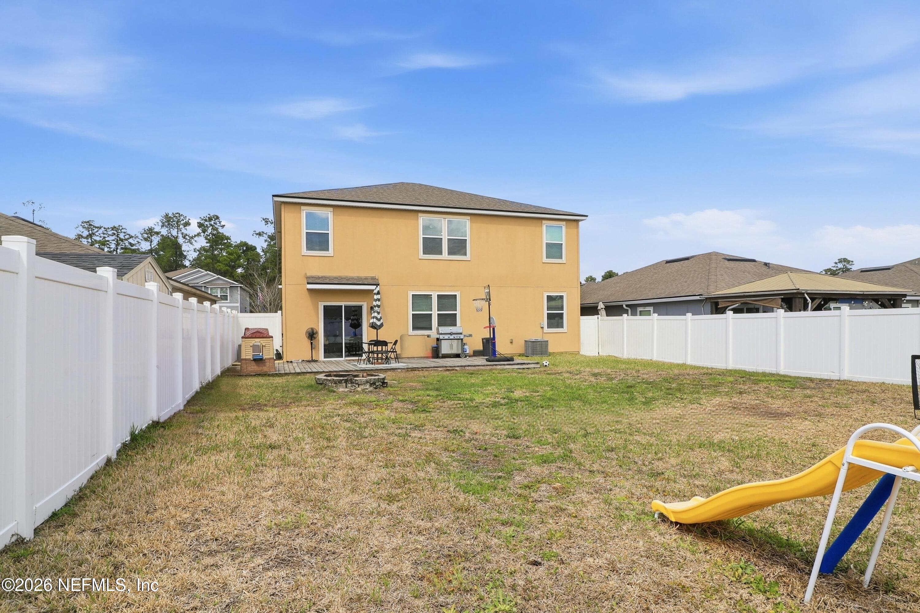 3825 Bronco Road Middleburg, FL 32068 - Photo 5 of 18 a view of a house with backyard and sitting area