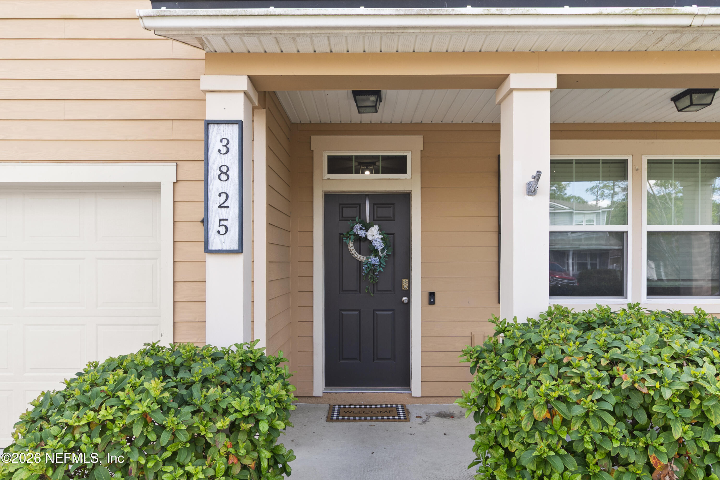3825 Bronco Road Middleburg, FL 32068 - Photo 7 of 18 a front view of a house with a glass door
