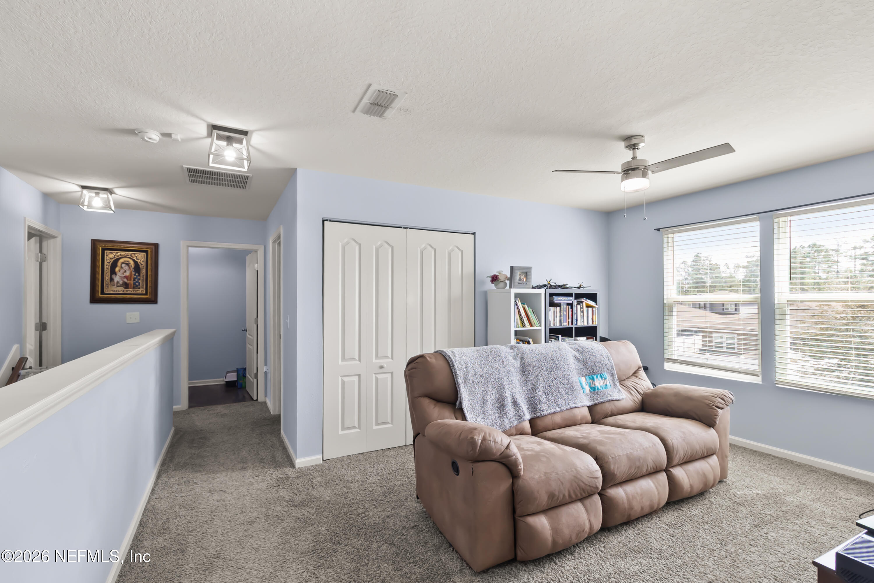 3825 Bronco Road Middleburg, FL 32068 - Photo 8 of 18 a living room with furniture and a large window