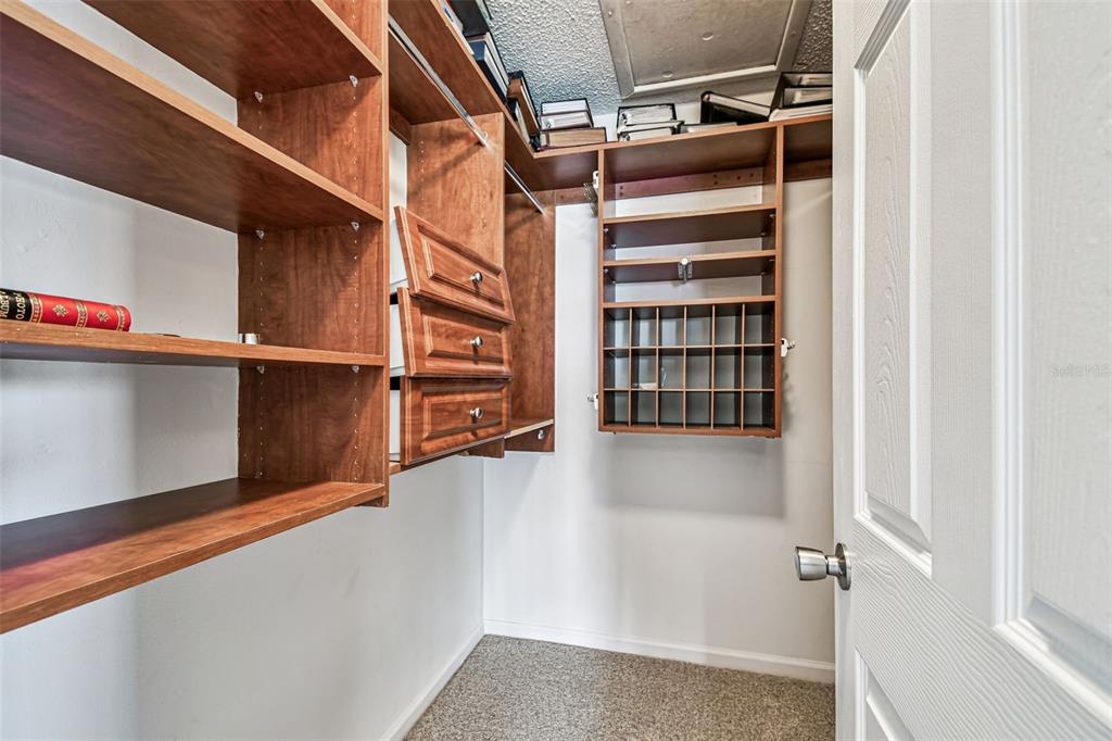 529 Johns Pass Avenue Madeira Beach, FL 33708 - Photo 29 of 100 a view of walk in closet with empty racks