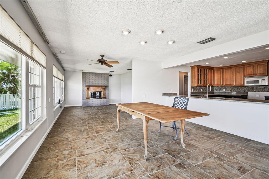 529 Johns Pass Avenue Madeira Beach, FL 33708 - Photo 51 of 100 a living room with furniture a table and kitchen view
