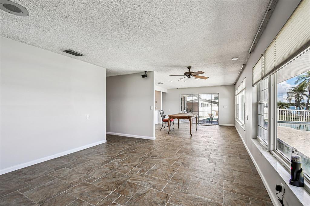 529 Johns Pass Avenue Madeira Beach, FL 33708 - Photo 56 of 100 a view of a livingroom with wooden floor and furniture