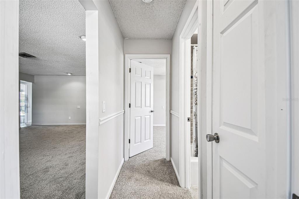 529 Johns Pass Avenue Madeira Beach, FL 33708 - Photo 65 of 100 a view of a hallway with closet and wooden floor