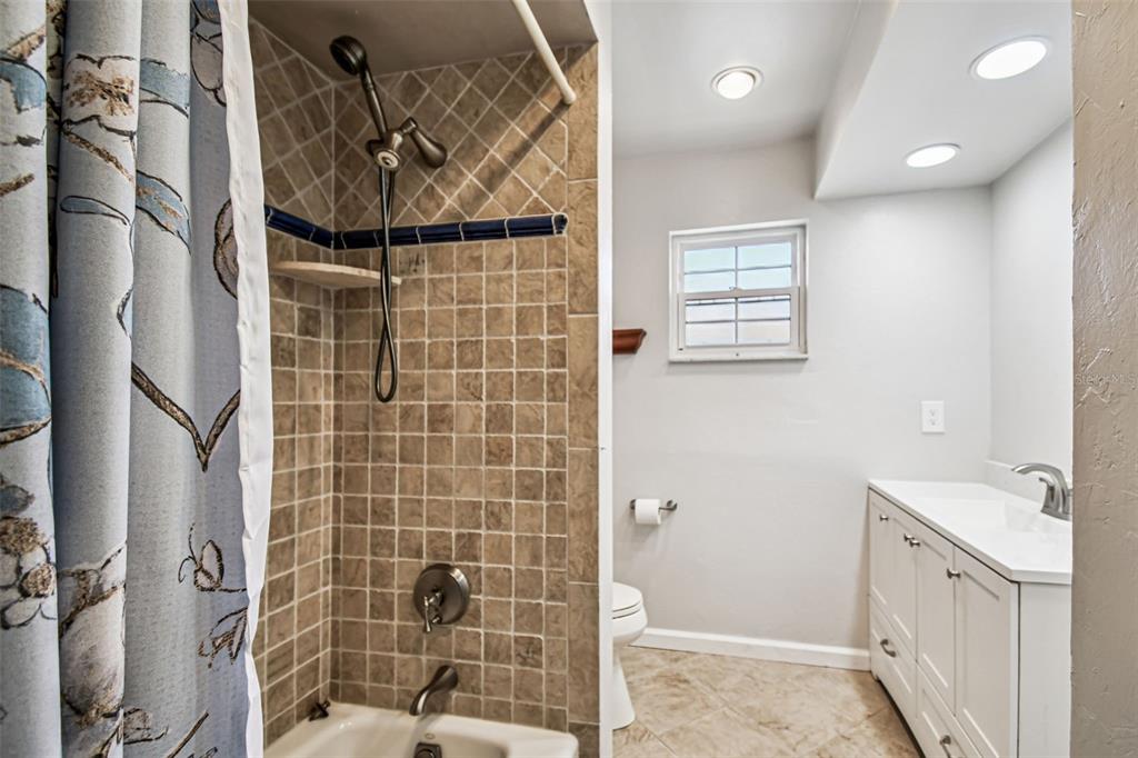 529 Johns Pass Avenue Madeira Beach, FL 33708 - Photo 66 of 100 a bathroom with a shower