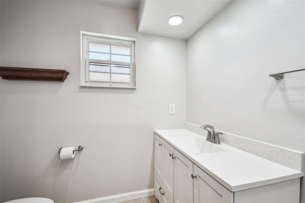 529 Johns Pass Avenue Madeira Beach, FL 33708 - Photo 67 of 100 a bathroom with a sink and a vanity