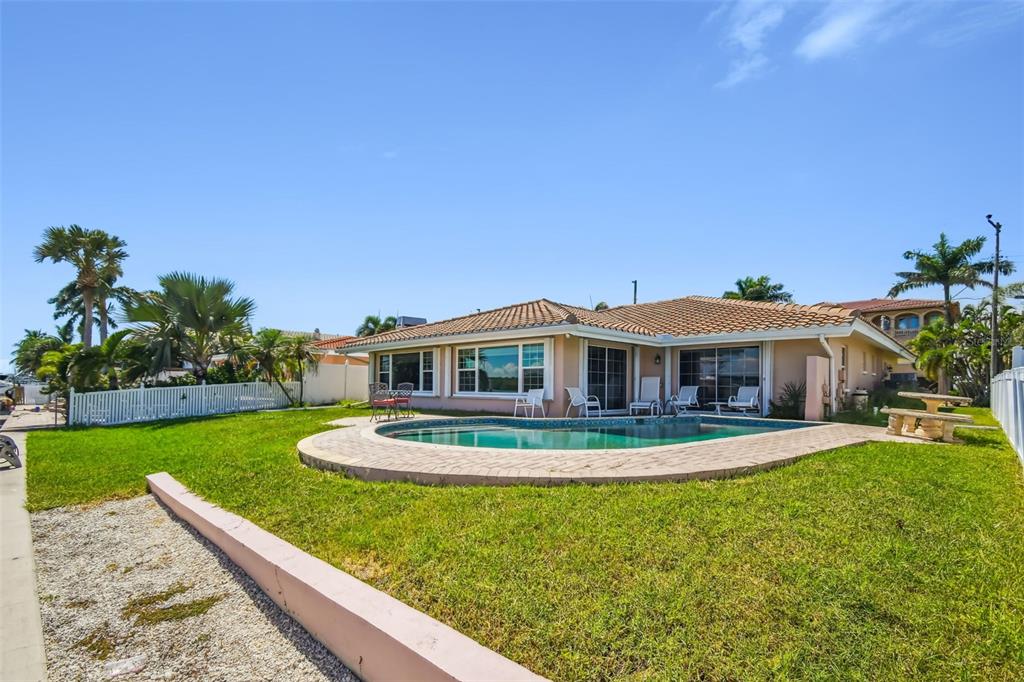 529 Johns Pass Avenue Madeira Beach, FL 33708 - Photo 75 of 100 a front view of a house with a yard