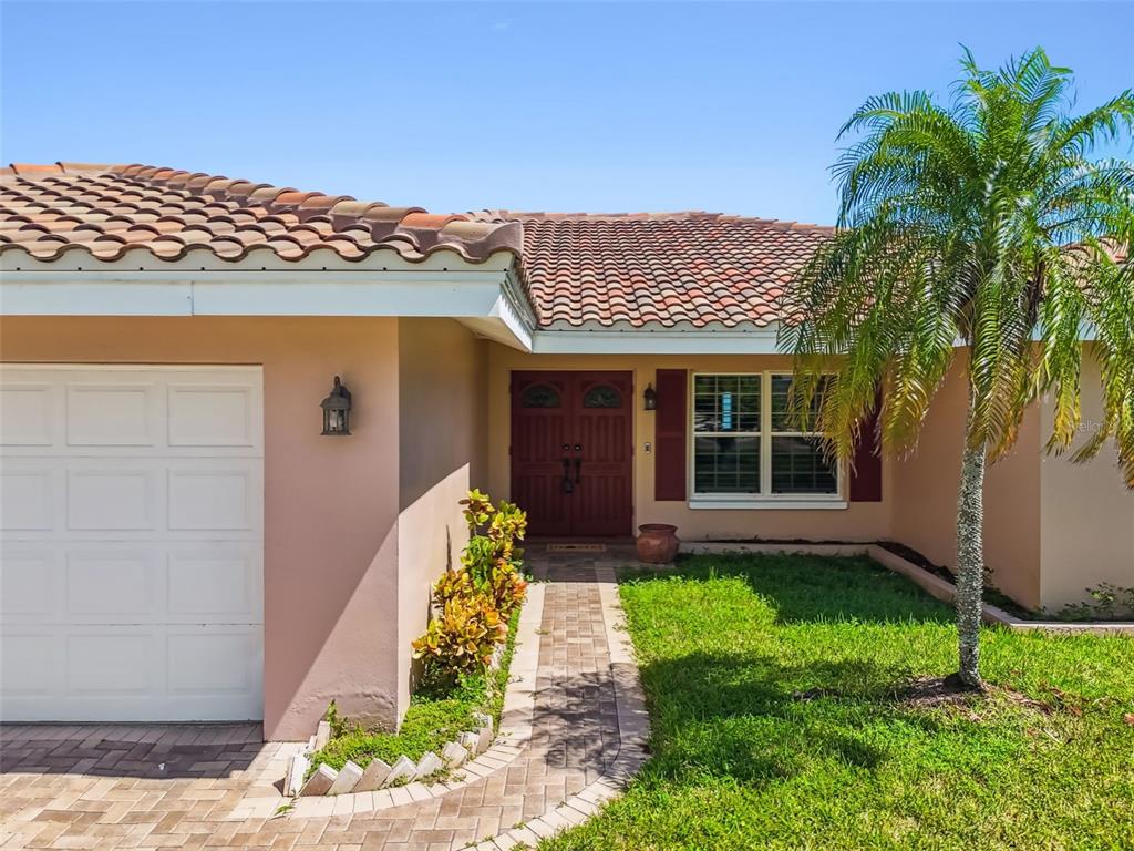 529 Johns Pass Avenue Madeira Beach, FL 33708 - Photo 82 of 100 a front view of a house with a yard